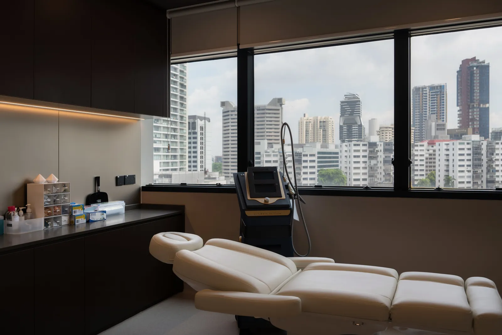 Rooms for Renewal: treatment room with a reclining bed and a view over the Orchard Road skyline