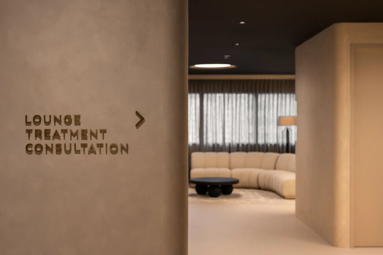 Rooms for Renewal: signs to the lounge, treatment and consultation rooms, with the lounge beyond