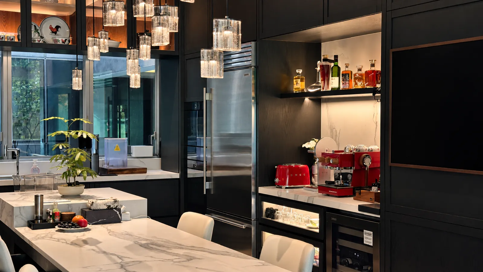 The Garden Within: dark timber kitchen with a marble island, glass pendants and a red coffee corner
