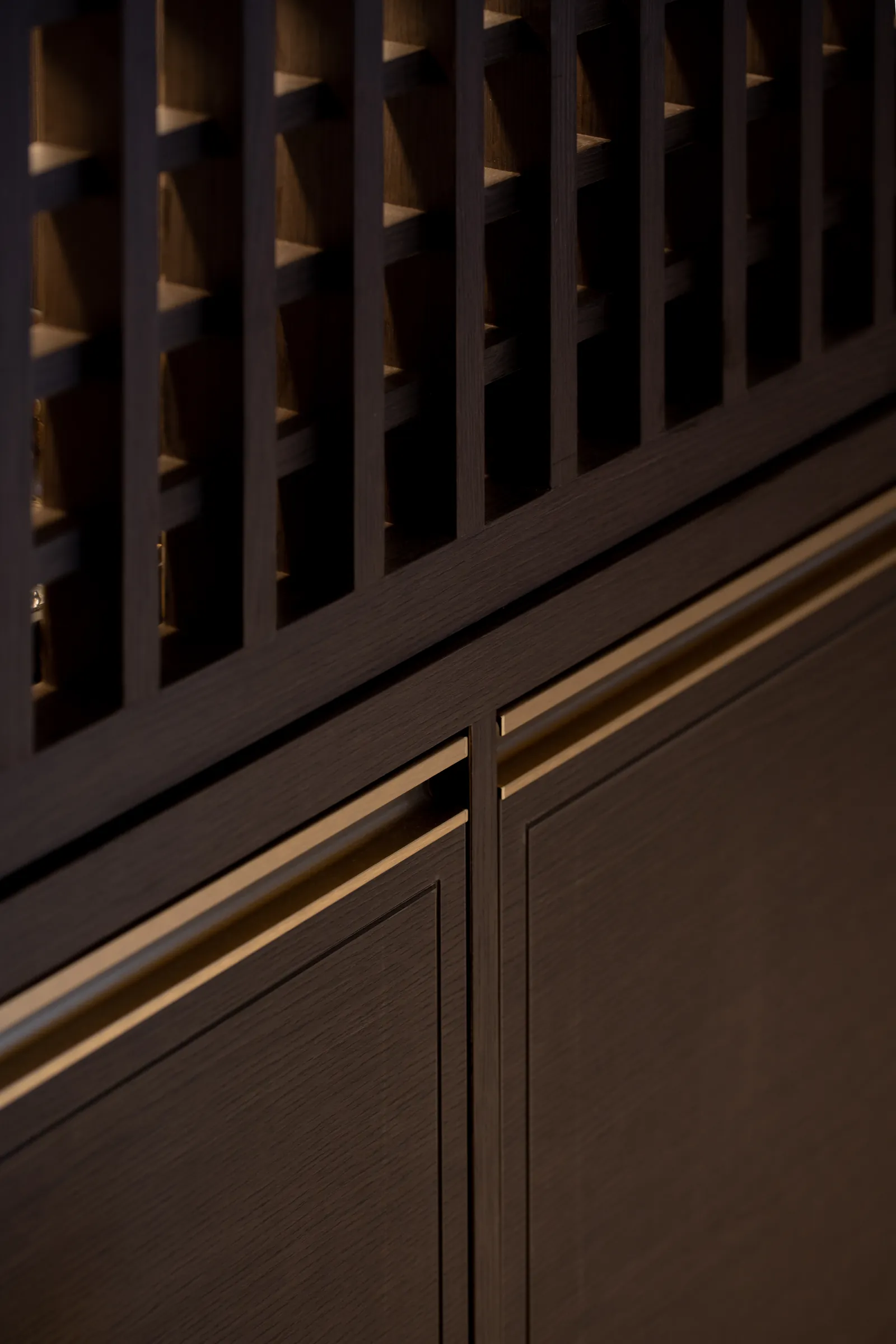 Villa in the Sky: lattice and timber cabinet doors with a line of light along the handles